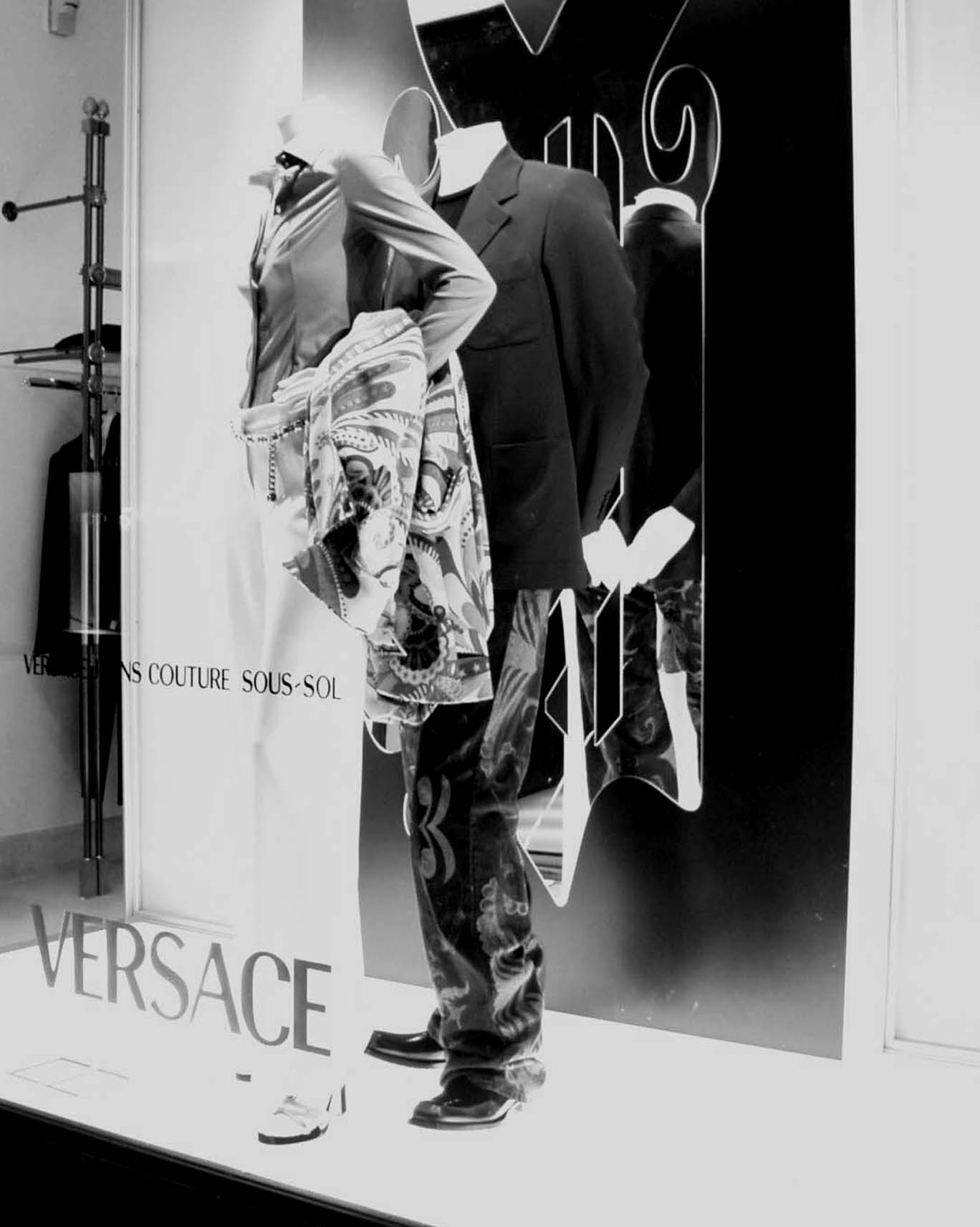 Versace shop window with mannequins in patterned clothes