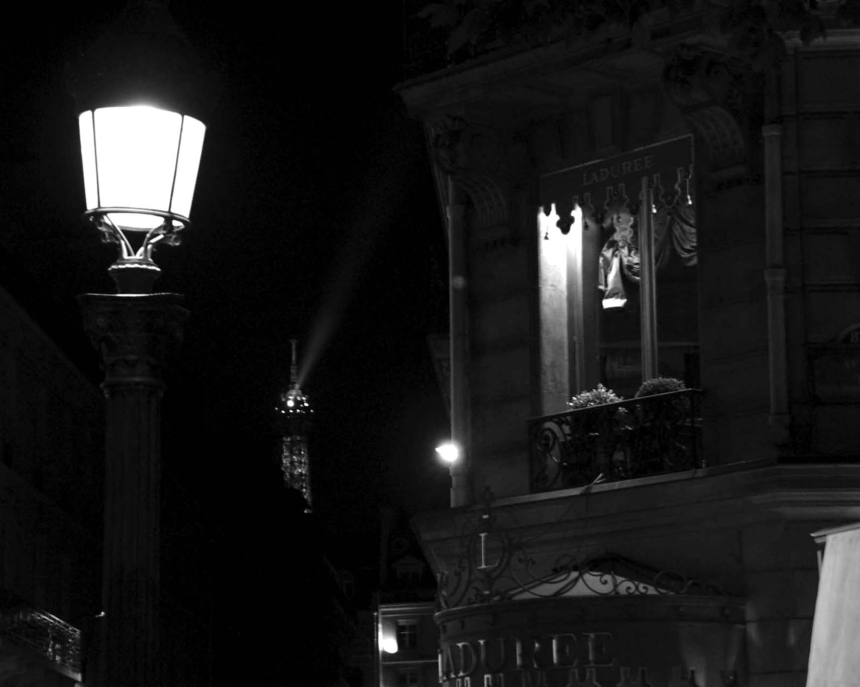 Street lamp, the Eiffel Tower’s searchlight and the Ladurée shopfront