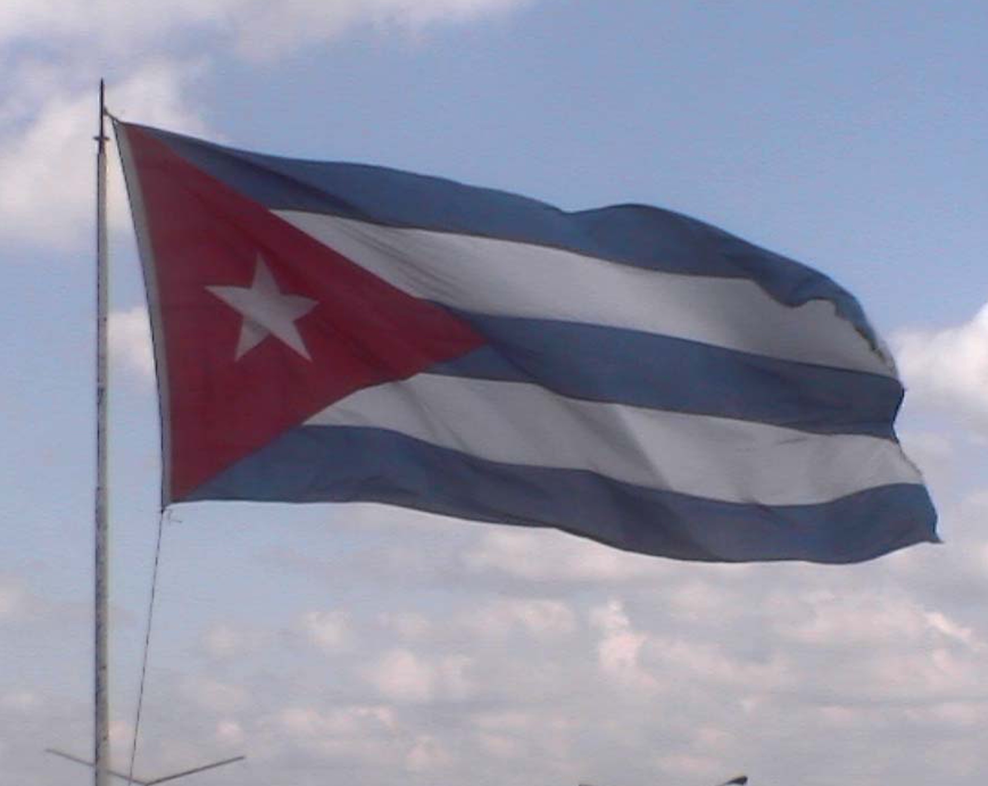 Cuban flag flying against the sky