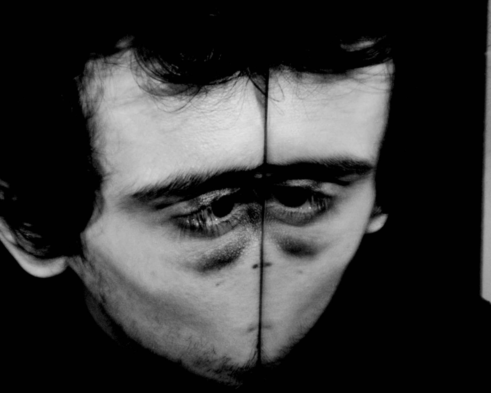 Face divided down the middle by a vertical mirror line