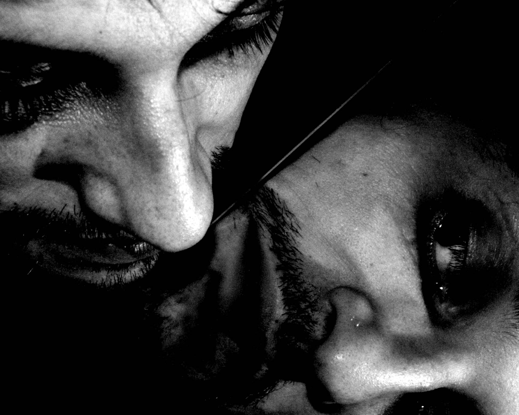 Two halves of a face meeting at a diagonal mirror edge