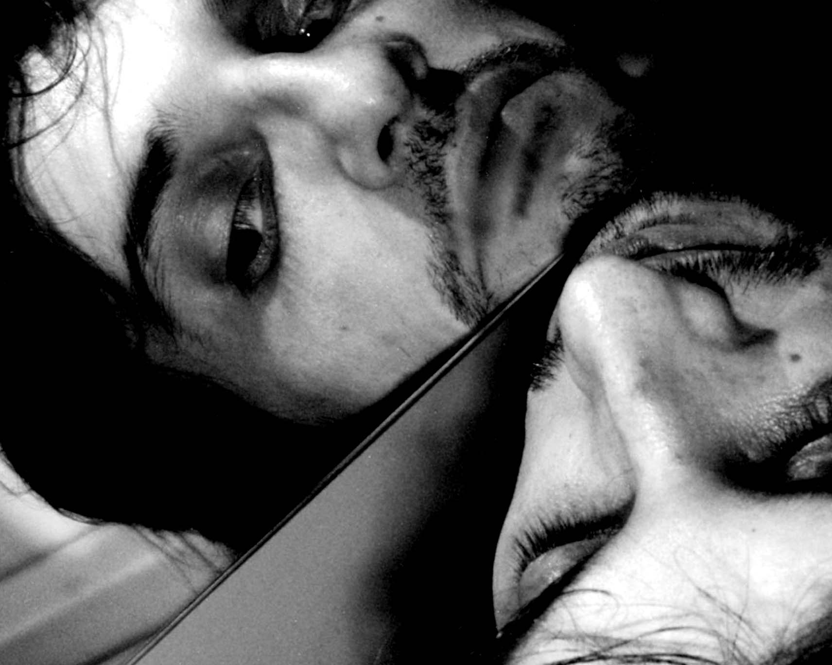 Face lying on its side, mirrored along a diagonal line
