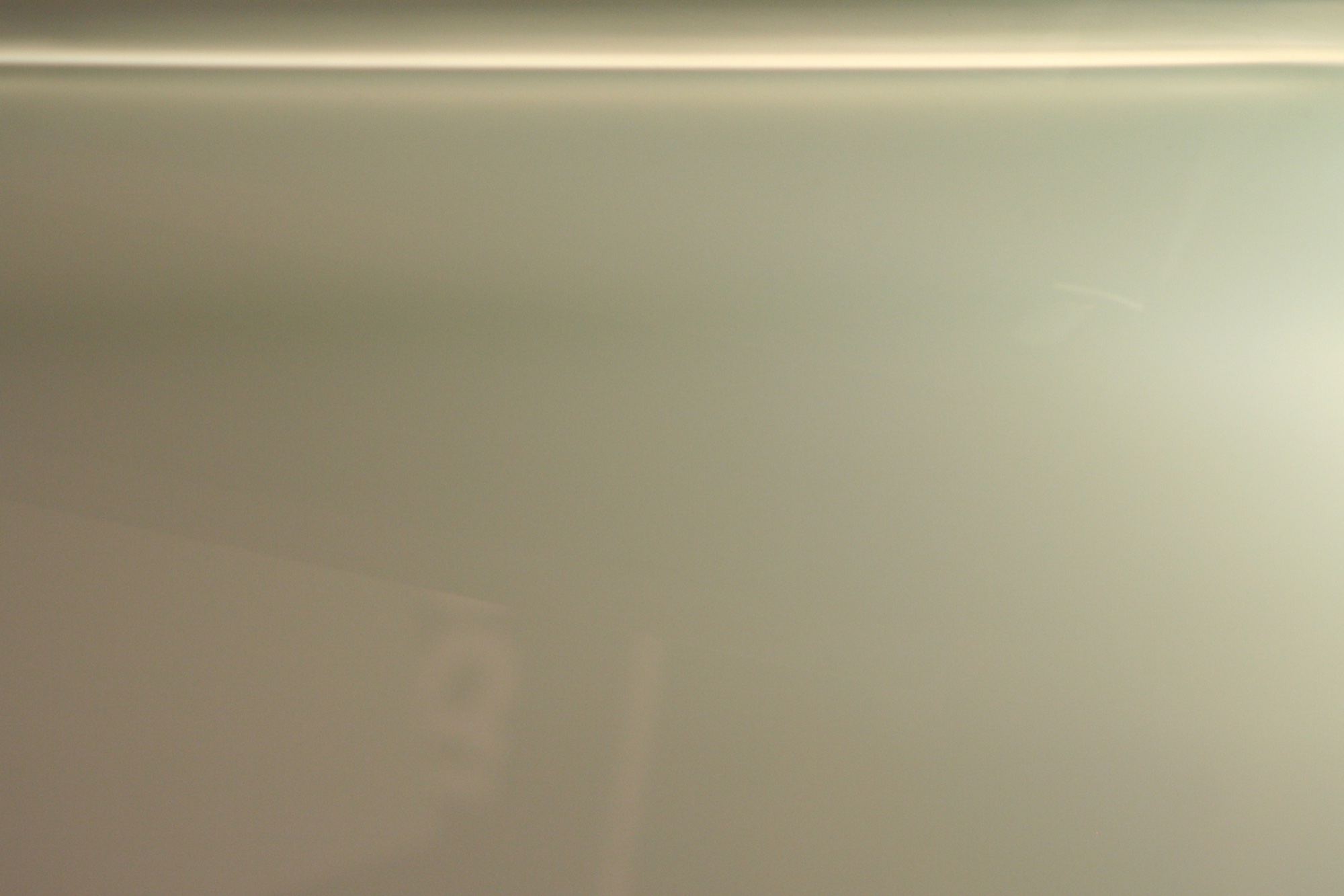 Pale frosted glass under a soft light