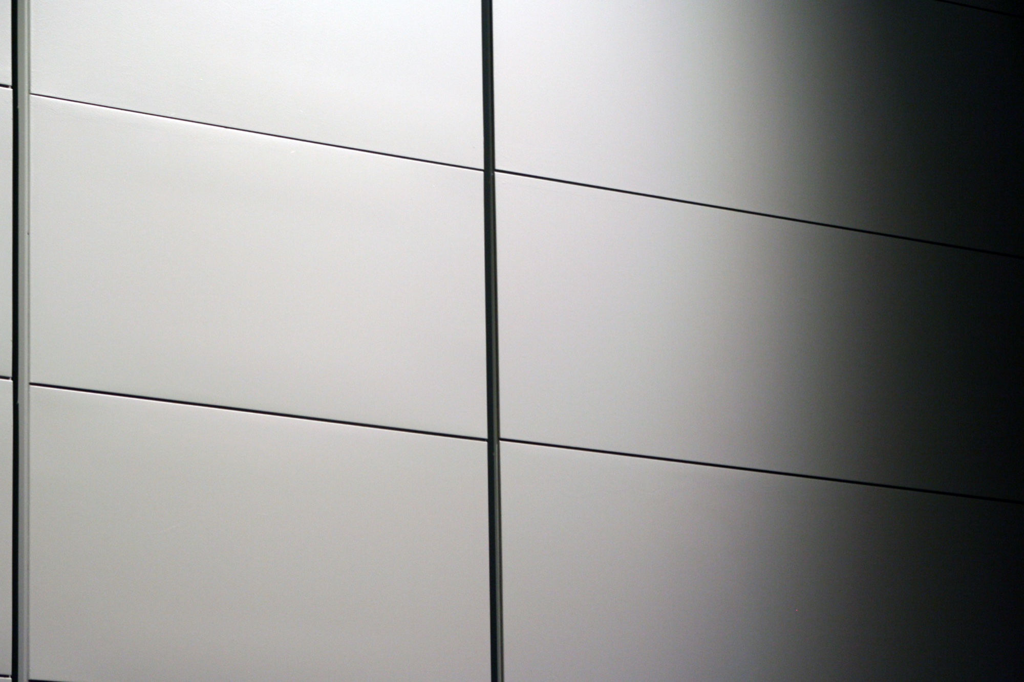 White panels with dark joints fading into black