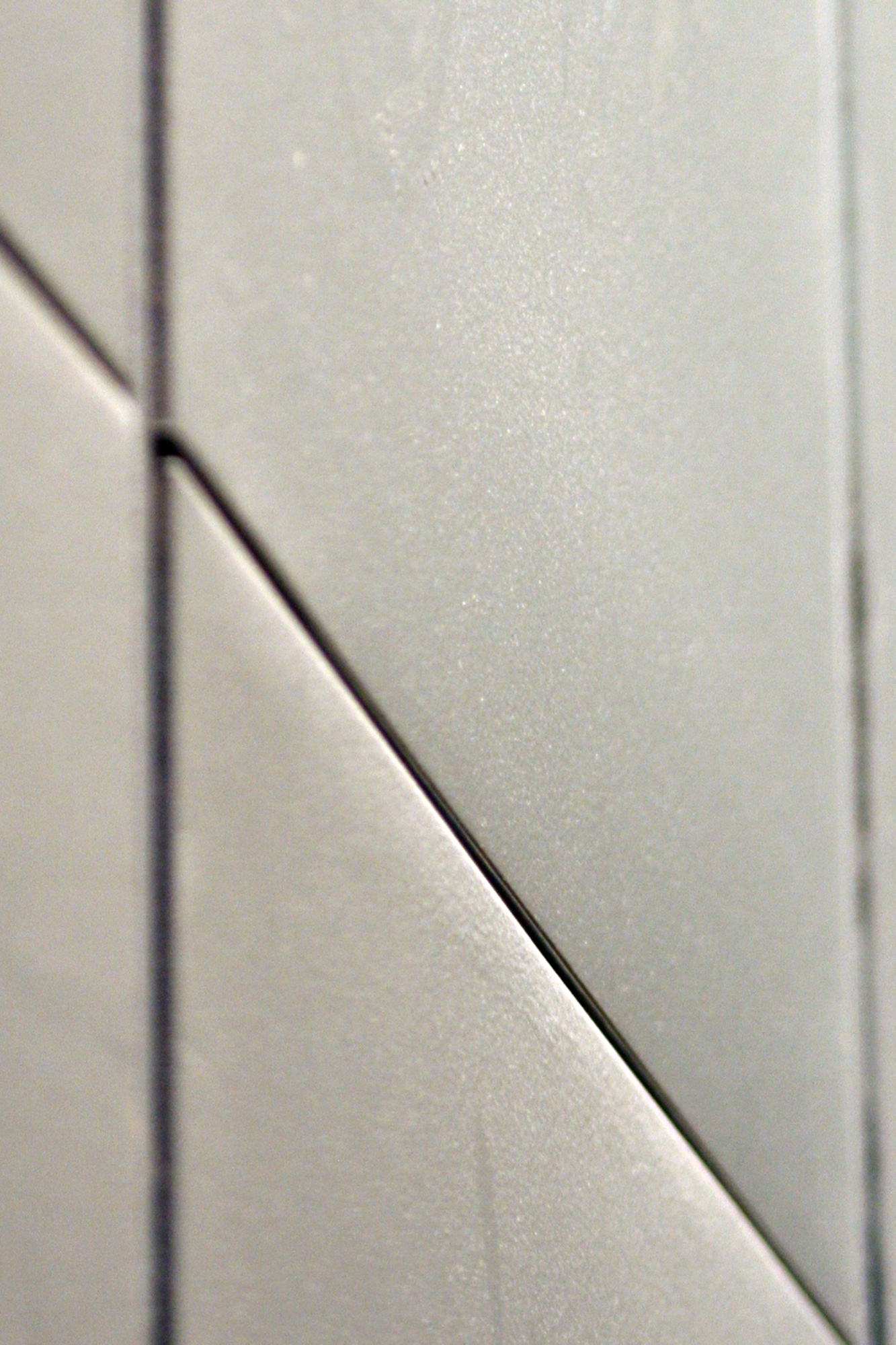 Pale panels meeting at an angle