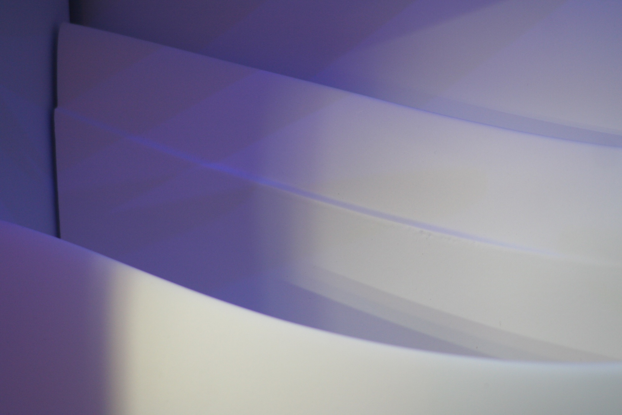 White curved surfaces in violet light