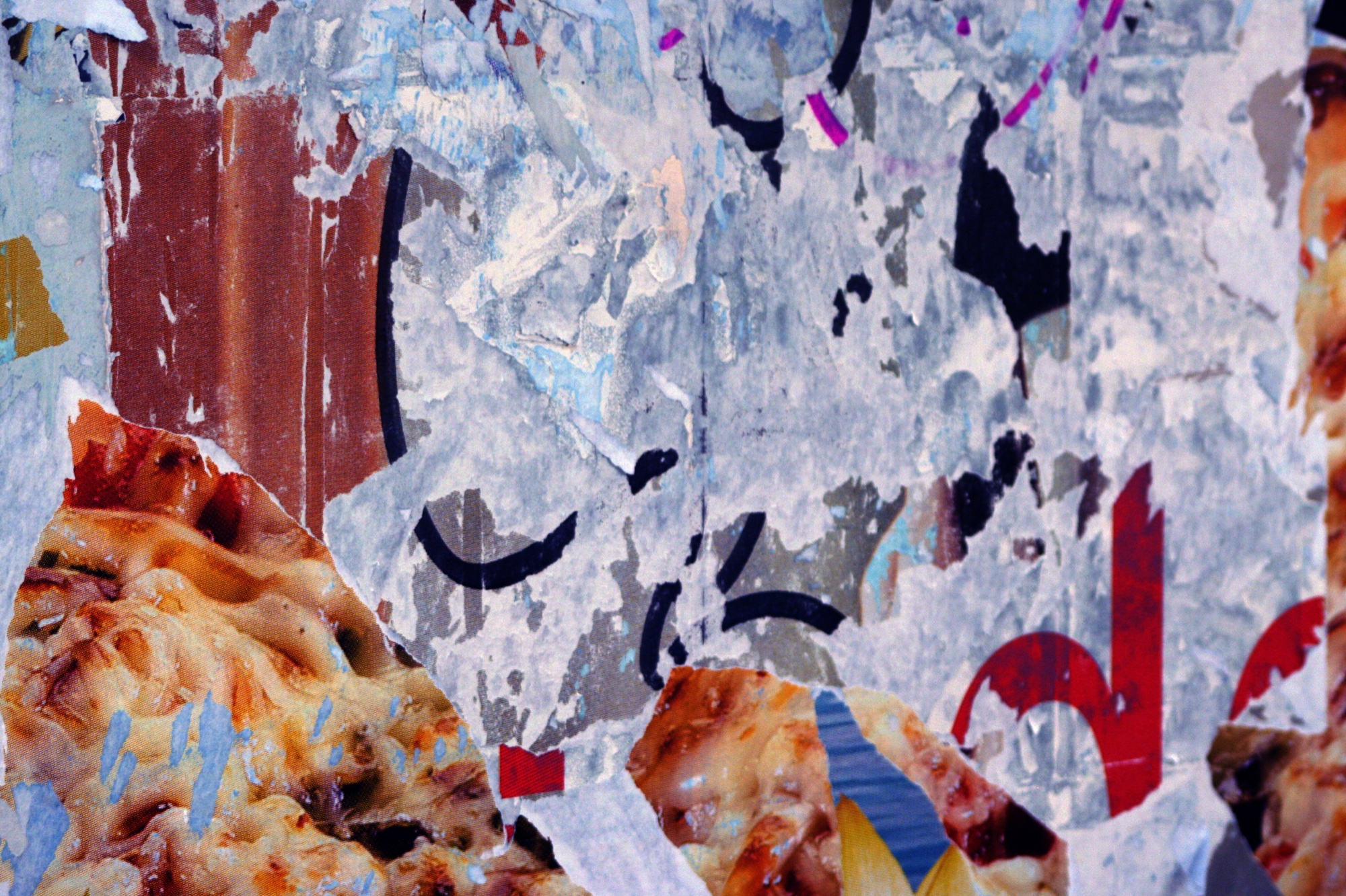 Torn posters in layers of colour