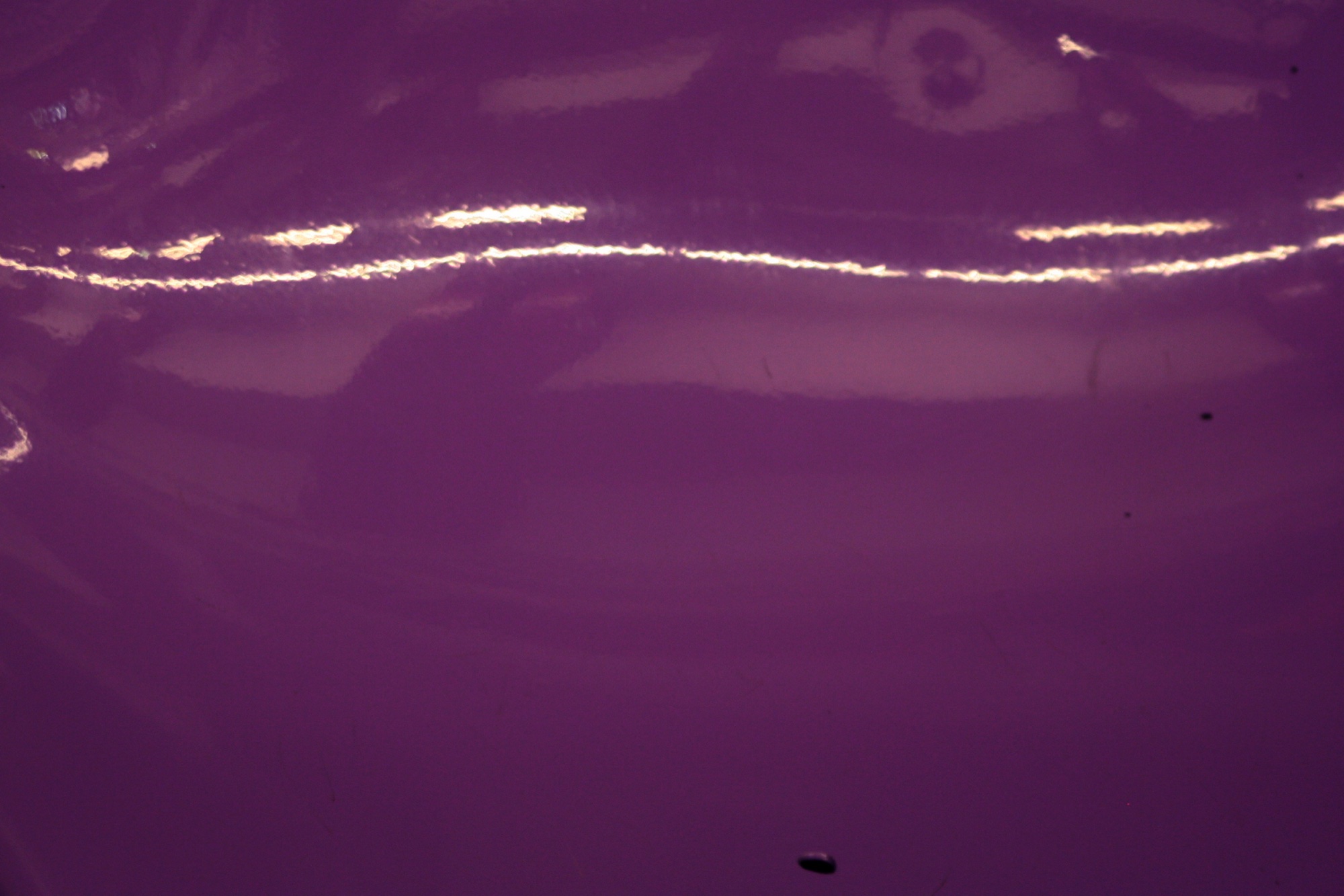 Violet water with a line of reflected light