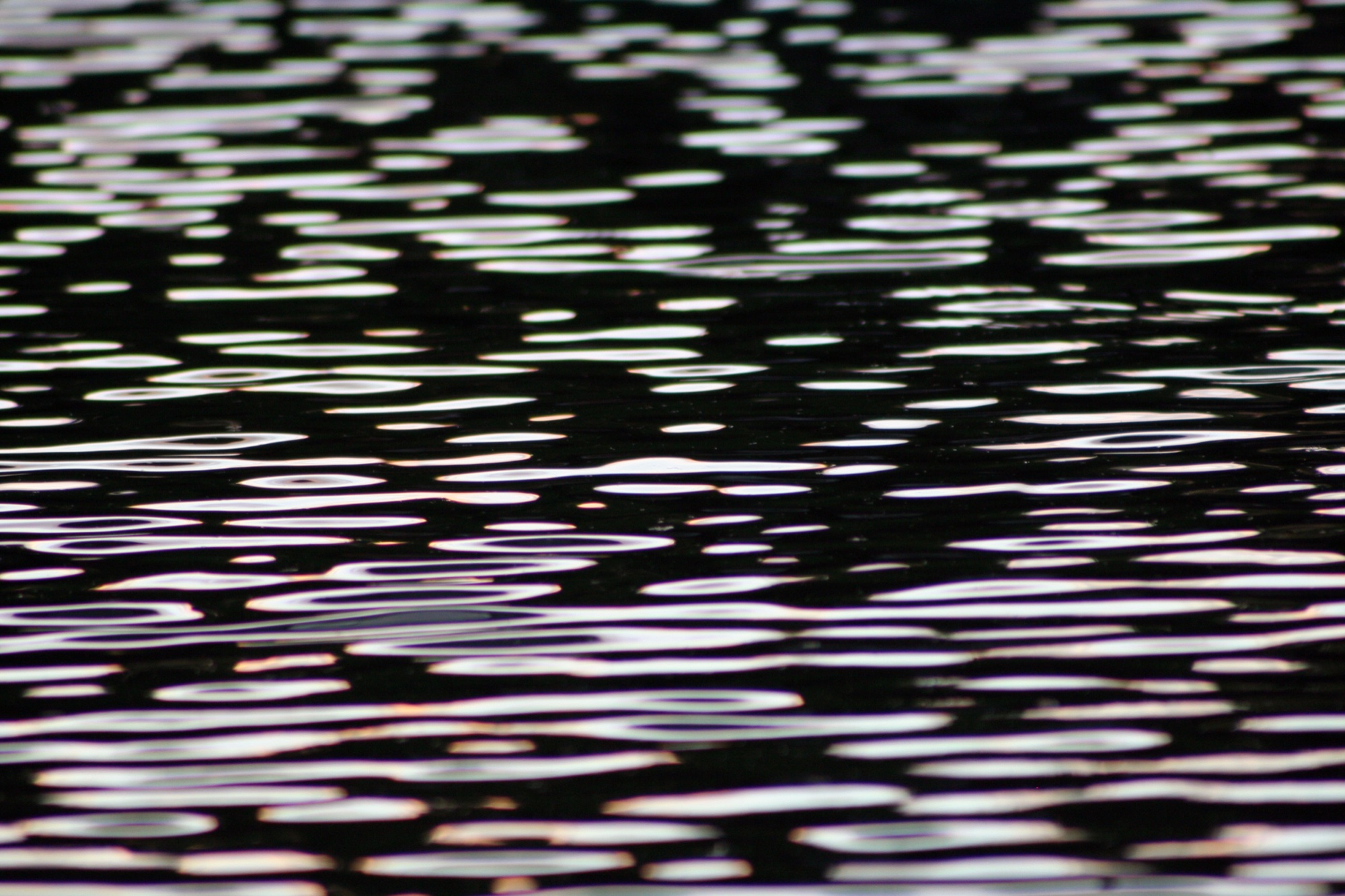 Black water broken into silver ripples