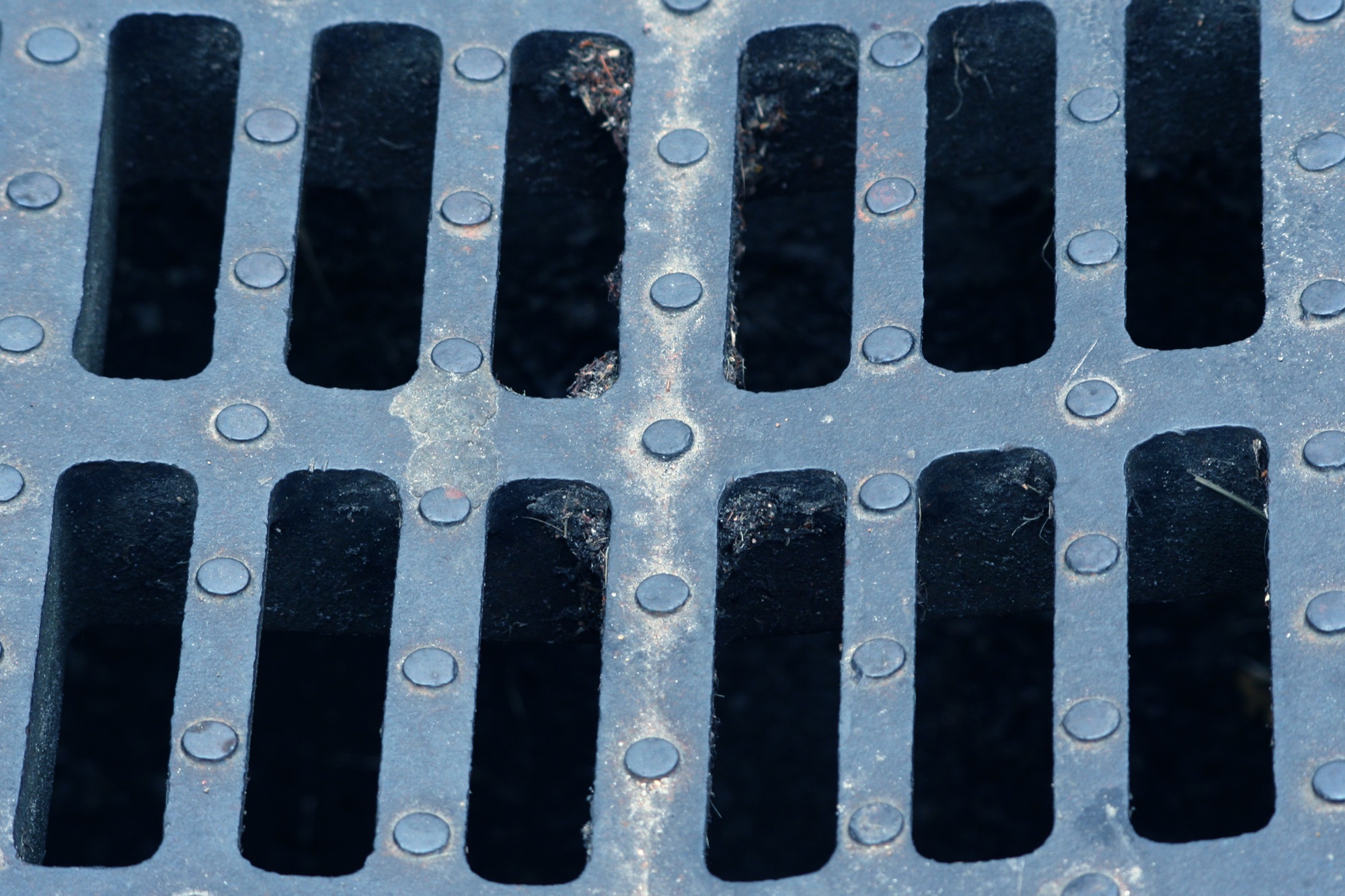 Metal grate with rows of slots